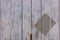 Close up on painted grey wooden wall with rectangle stamped