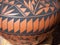 Close Up of a Painted  Terracotta Pot with Black Geometric and Lizard Decorations