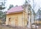 Close up on Painting and Plastering Exterior House Wall. Building House Construction with Metal Roof in the Forest.