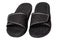 Close-up of a pair of black rubber sandals or slippers for the shower swimming pool or beach with slip-resistant outsole Isolated