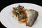 Close up of a pan seared grill seabass fish fillet with tomato