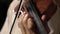 Close up pan shot of a violin player in dark room