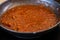 Close-up of a pan with tomato sauce in preparation. Liquid tomato for pizza or pasta