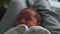Close up parent holding newborn baby. Close up contented parents and baby