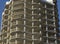 close-up of a part of a multi-storey residential building made of concrete and metal