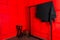 Close up of part photo studio with chair and red background