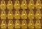 Close up a part of ten thousand golden buddhas lined up