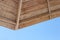 Close-up of a part of a wooden beach umbrella