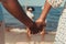 close-up partial view of african american couple holding hands while standing