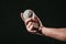 close-up partial view of male hand holding baseball ball