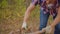 Close-up partial view of man chopping wood with axe