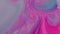 Close-up of pastel blue white and pink oil paints are blended