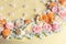 Close up pastel colored cream flowers cake decoration