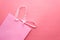 Close up pastel shopping bag on pink background.