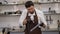 Close-up of a pastry chef or chocolatier making chocolates with purple dye.