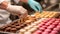 A close-up of a pastry chef creating a symphony of colorful macarons