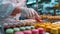 A close-up of a pastry chef creating a symphony of colorful macarons