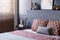 Close-up of patterned pillows lying on a soft bed in bedroom int