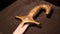 Close-up of patterns of handle of medieval weapon. Stock footage. Ancient weapons of Slavic or Eastern people in Museum