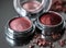 A close-up of pearlescent shimmery pink eyeshadows for creating eye makeup