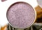 A close-up of pearlescent shimmery purple eyeshadow for creating eye makeup.