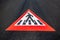 Close-up of pedestrian sign painted on asphalting road.