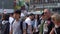 Close up pedestrians walking on Shibuya Crossing in day time slow motion video .