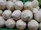 Close-up of the peeled coconuts, lined up in the Asian market shops.