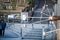 Close up people hand try to scooping water from 3 holy water line with long handle cup in Kiyomizu-dera temple, Japan