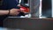 Close-up of people passing electronic turnstile with barcode scanner. Media.Electronic access control indoor security