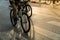 Close-up people riding on bike in the city street at early morning. Outdoor excercise sport