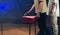 Close-up of people throwing ball into red plastic beer cups. Playing beer pong at the party