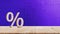 Close-up of percent sign leaning on wooden table, Percentage Sign And Discount Rate. Accountant VAT Tax Concept