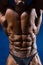 Close up on perfect abs. Strong bodybuilder with six pack