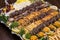 Close up of Persian Mix Kebab consist of minced meat chicken and steak with rice in large tray