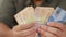 Close up of a person counting money, Uang Indonesian rupiah, cash in hand