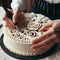 Close up of a person crafting intricate designs on top of a ve