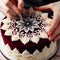 Close up of a person crafting intricate designs on top of a ve