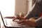 Close up of person fingers typing on laptop, business or education