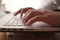 Close up of person hand typing on laptop keyboard, author writing on pc computer, businessman programmer working