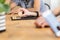 Close-up on person holding gold coin of Bitcoin - symbol of virtual money