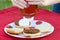 Close-up of Person Putting Ketchup on Hamburger