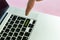 Close up person`s hand finger pushing the `follow` text on a button of laptop keyboard isolated concept v