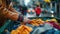 Close-up of a persons hands placing gently used clothing into a donation bin, with a focus on the act of giving