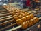 Close-up: Pho Kha is grilling curry fish cakes, local Thai food