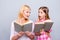 Close up photo adorable friendly blond hair she her grandma little granddaughter hold reading books share impressions