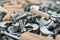 Close-up photo of assorted screws for furniture assembly on the wooden table