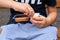 Close up photo of boy eats snack with melted cheese, fast food.