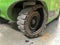 Close up photo of broken solid tire of a forklift