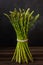 Close up photo Bunch of fresh green asparagus on wooden background